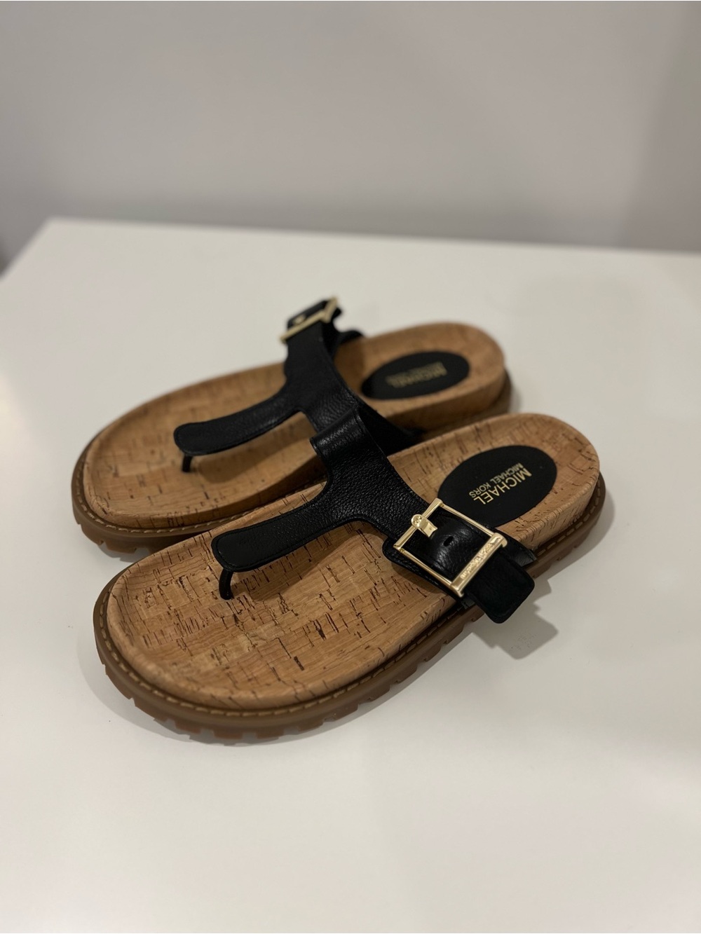 MICHAEL Michael Kors Black Leather Thong Sandals with Gold Buckles